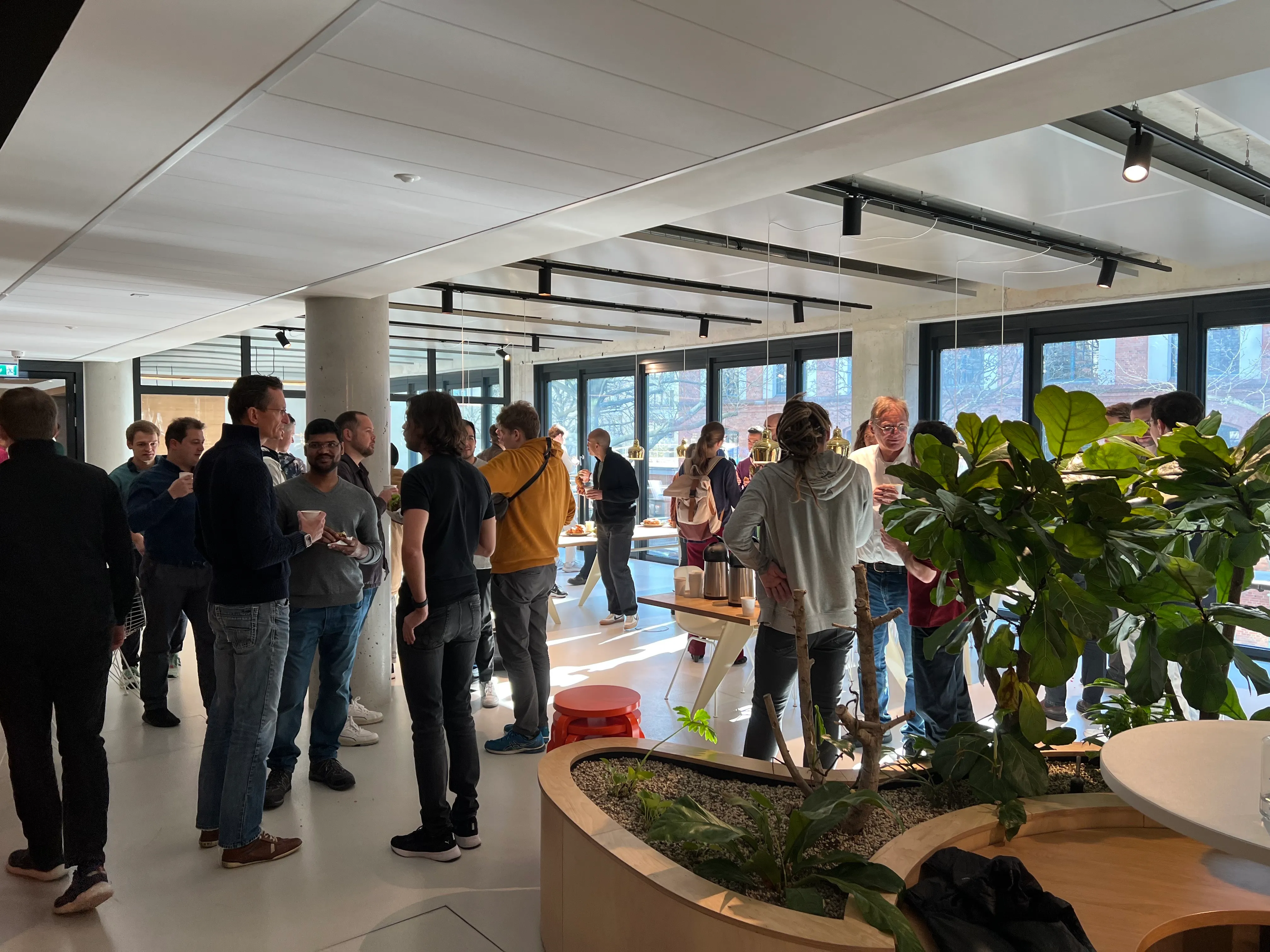 A group of people standing in a room.